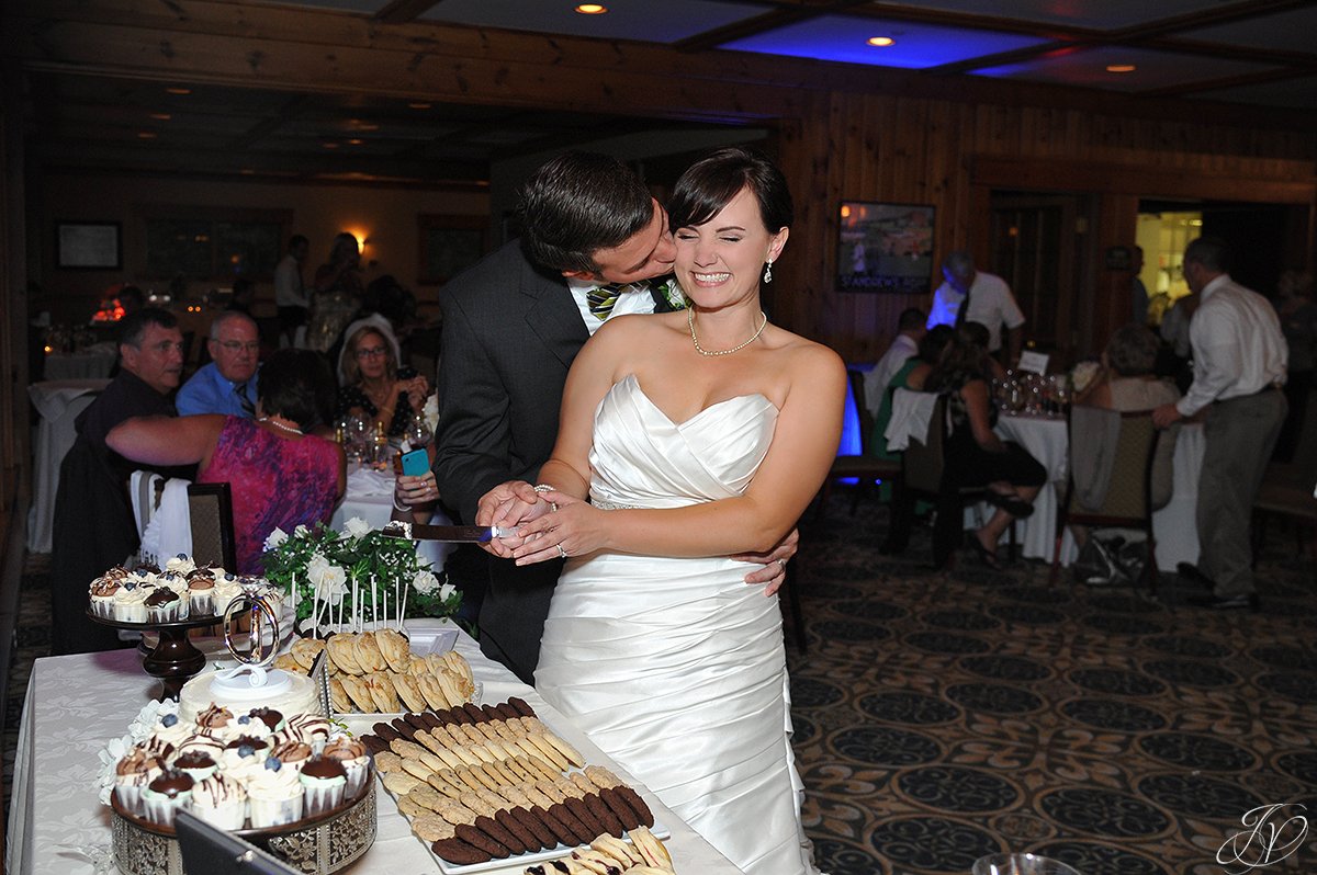 adorable wedding cake cutting photo