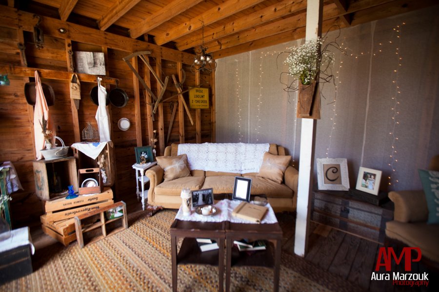 Wooden paneled room in this rustic barn in Seagrove features lots of antiques and rustic details. © Aura Marzouk Photography