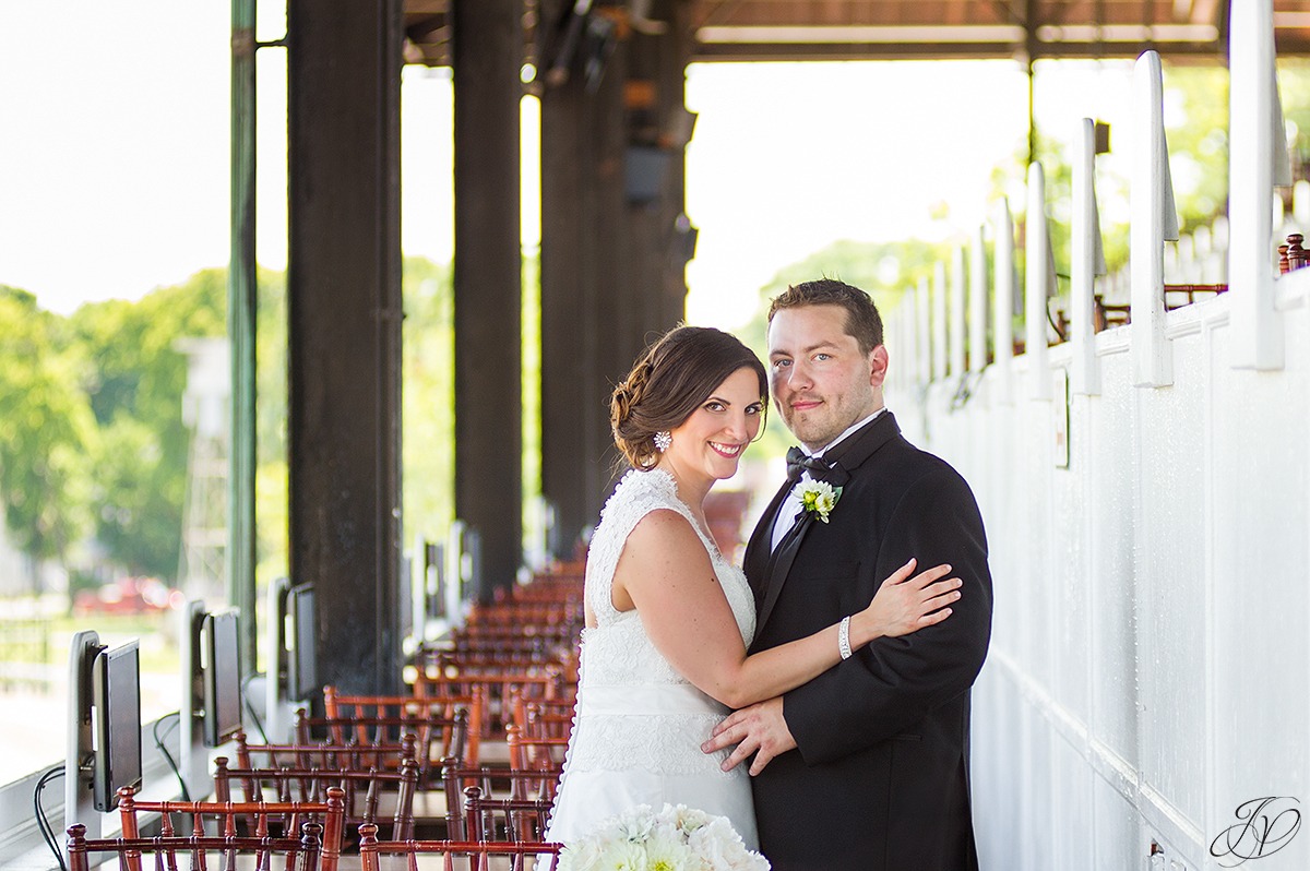 cute photo of bride and groom at saratoga race track