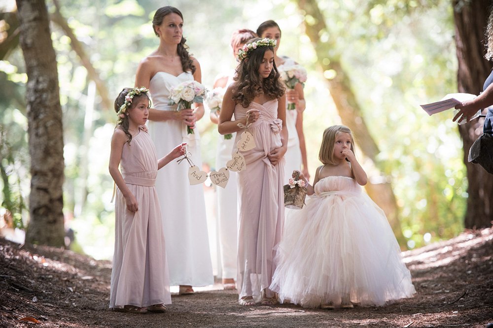 Flower girls walk to Redwood Grove wedding ceremony