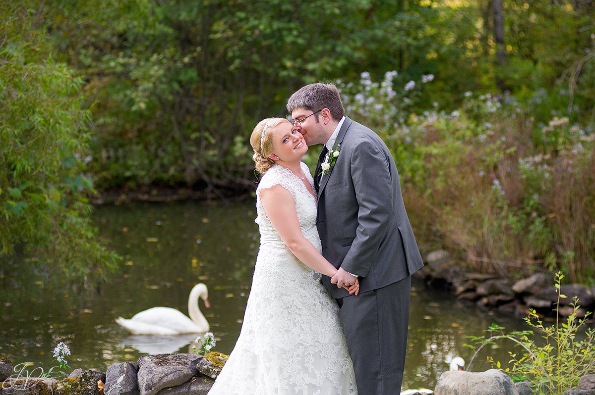 vintage photo of bride and groom in front of pond