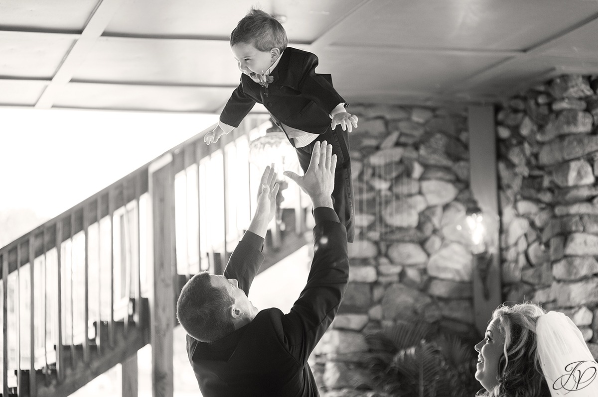 cute photo of son being thrown in the air