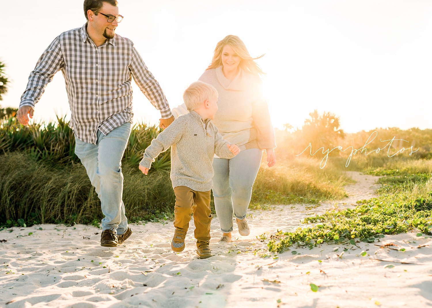 mom and dad running with boy on beach, Saint Augustine Beach, Florida, Ryaphotos