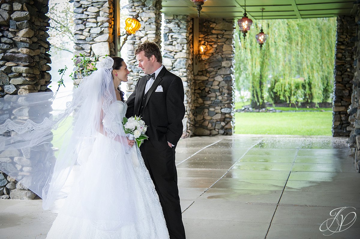 wind blown veil photo, candid moment with bride and groom, bride and groom candid photo, albany ny wedding photographers