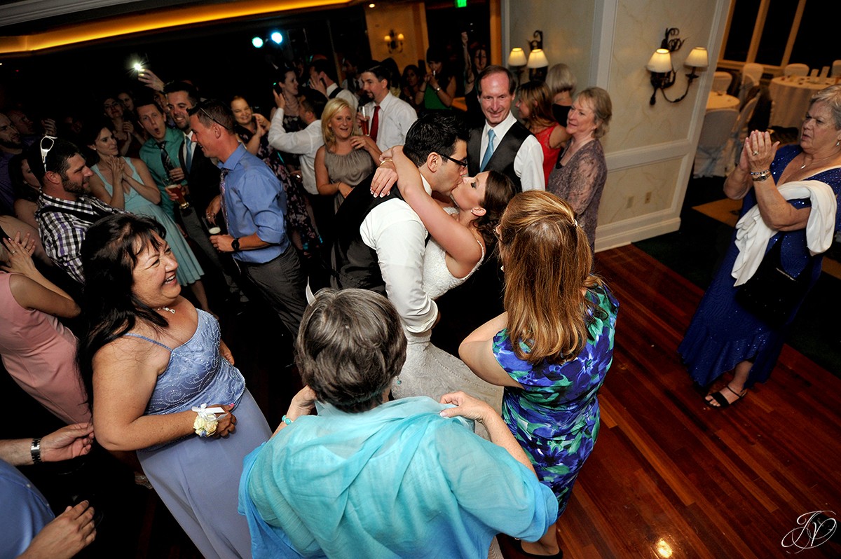 groom dips bride during wedding reception