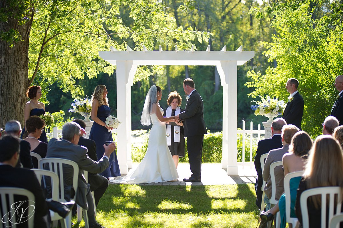 bride and groom at alter, schenectady wedding photographer, riverstone manor