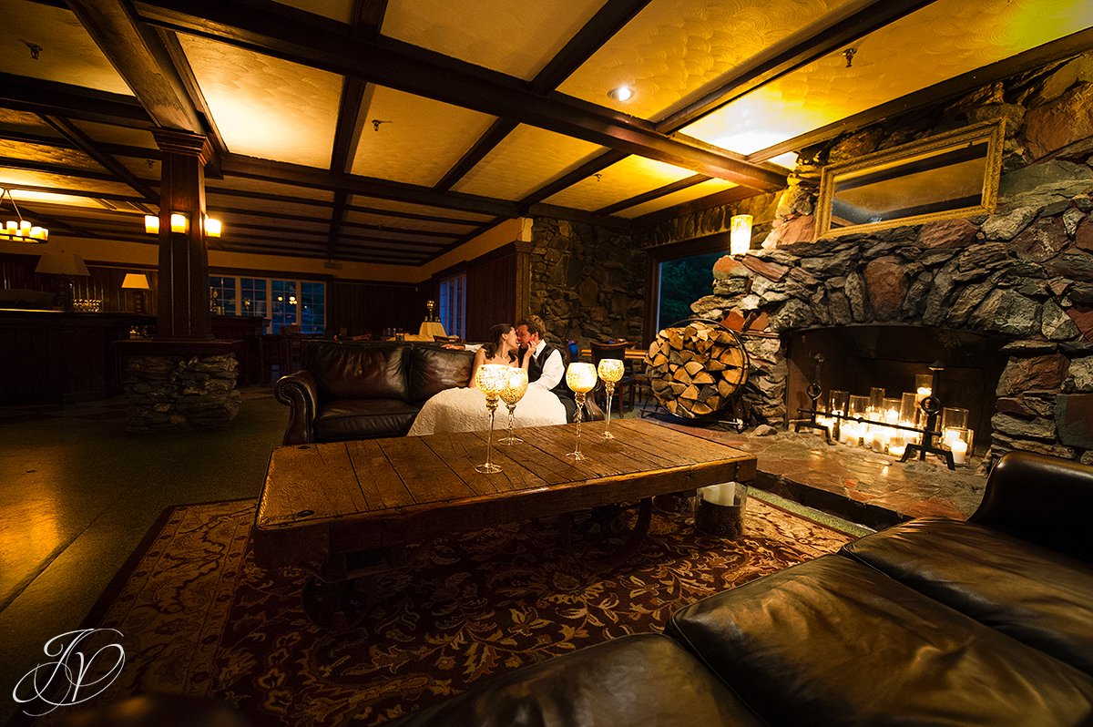 bride and groom alone photos, bride and groom candid photos, bride an groom by fireplace photo