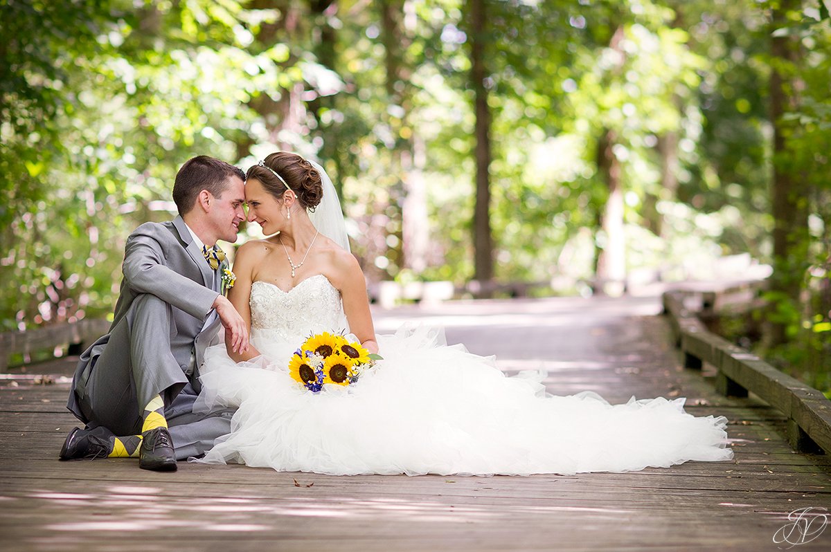 bride and groom on bridge walkway Timberlodge at Arrowhead Golf Club