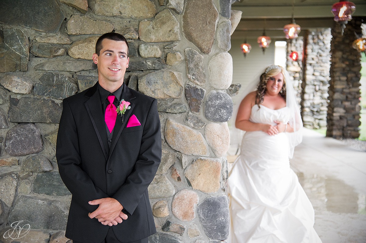 moments before the first look, bride peaking at groom before first look