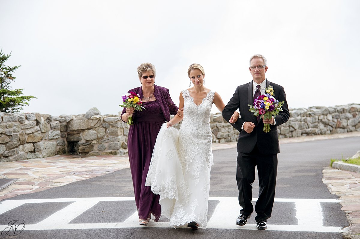 bride walking down the aisle with both parents whiteface mountain