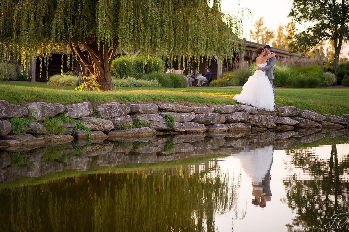 sunset bride and groom Arrowhead Golf Club water reflection