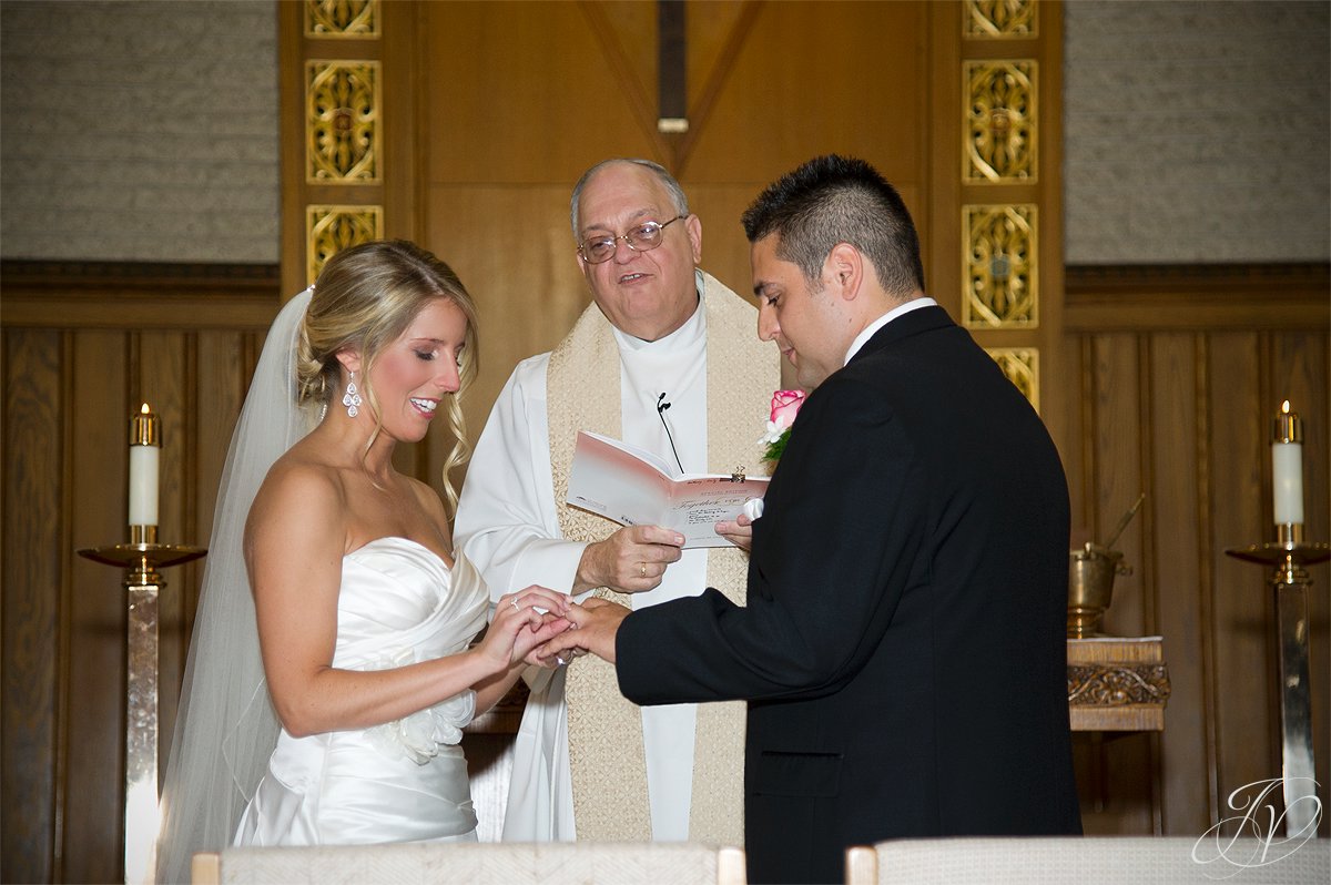 exchanging rings, church and flowers photo, Schenectady Wedding Photographer, Waters Edge Lighthouse