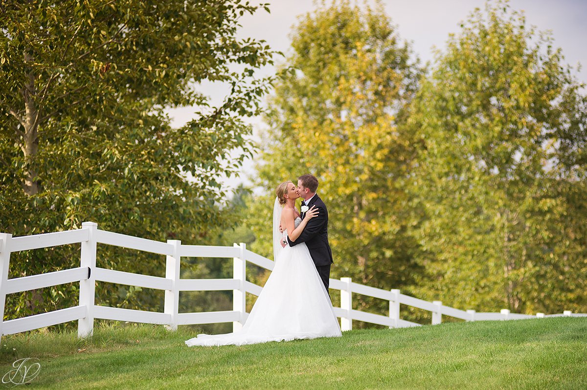 bride and groom white fence saratoga national