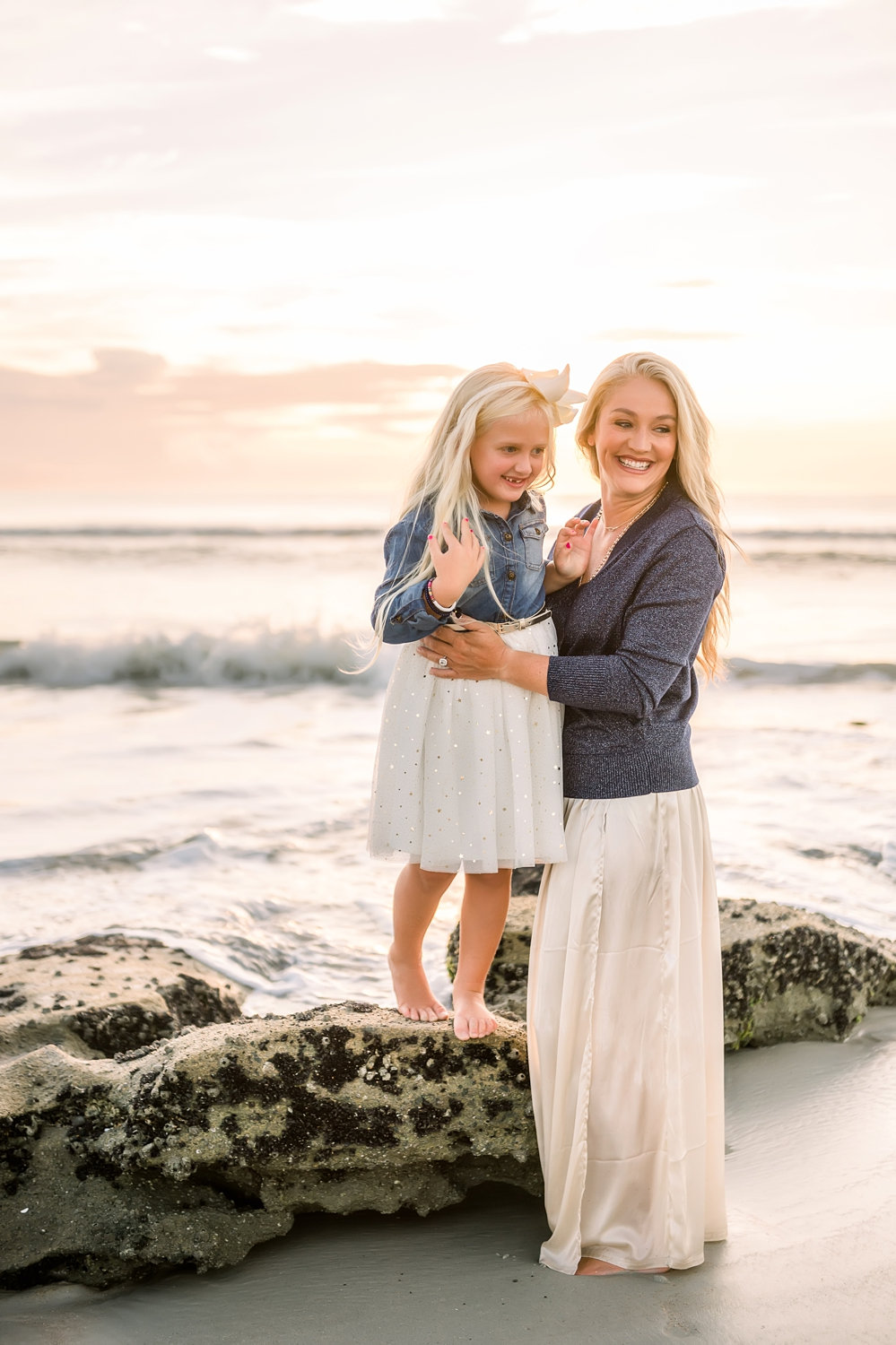 Saint Augustine Beach rock formations, mom and daughter at sunrise