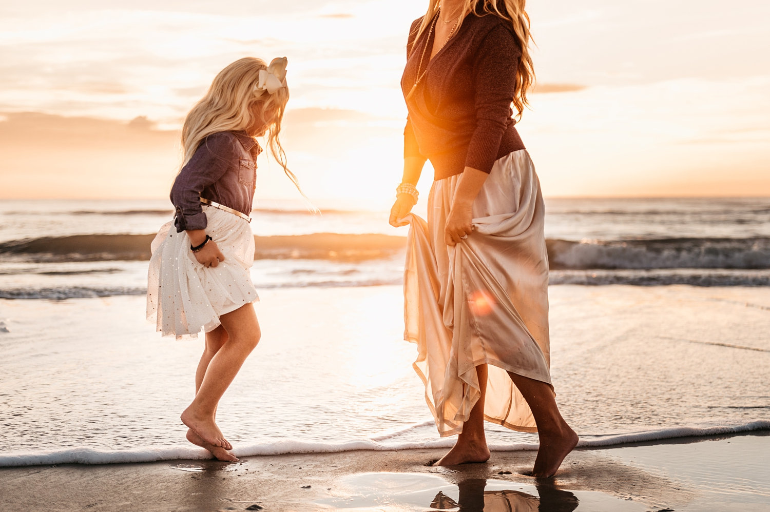 mother and daughter in the surf of Saint Augustine Beach, Florida