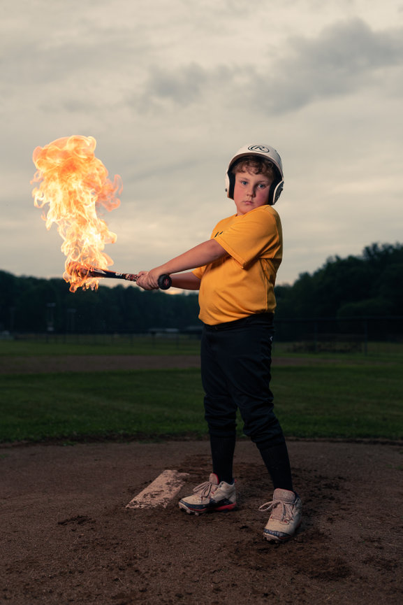 baseball player swinging bat