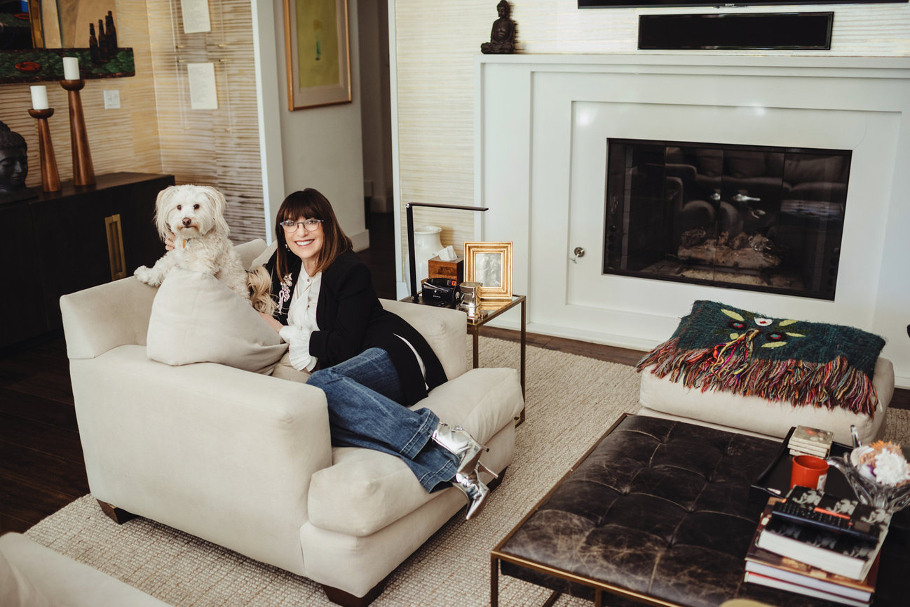 Lifestyle portrait taken of Barbara Molasky and her adorable puppy dog. Celebrate your pets with a timeless portrait by Adam Trujillo.