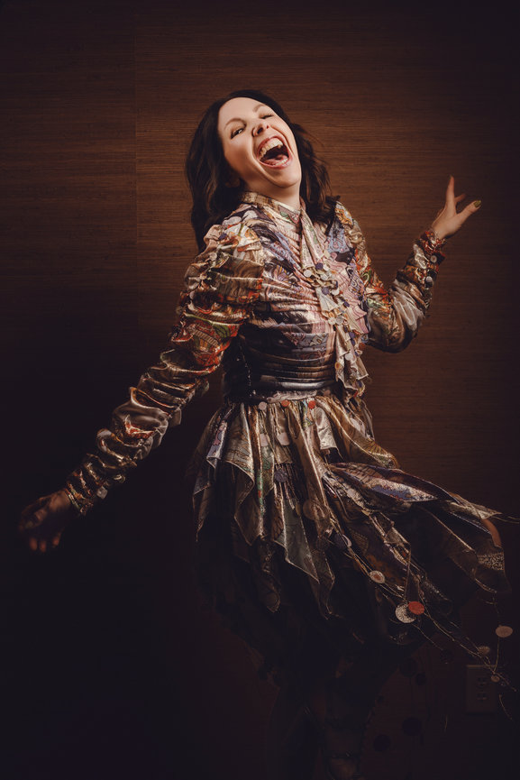 Dawn Hume having fun in studio with dynamic and colorful dress in home, portrait picture taken by Adam Trujillo, a Las Vegas portrait photographer.