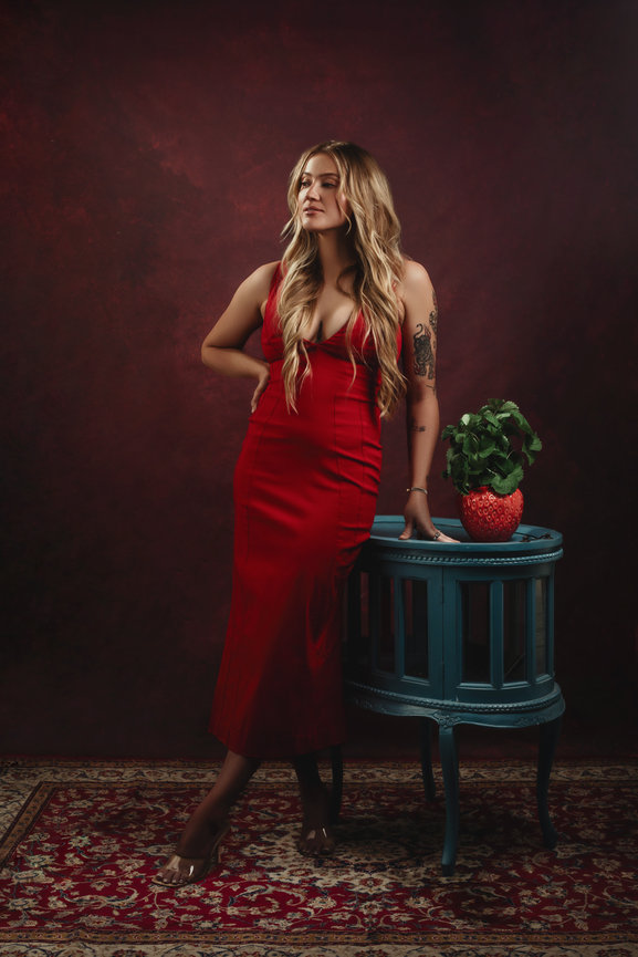 Check out this stunning red dress celebrating this college graduate photoshoot in studio celebrating with Adam Trujillo in Las Vegas.