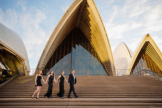 Portrait of a family on the steps of the Opera House during a Sydney Opera House Photoshoot with Sarah Iris Photography.