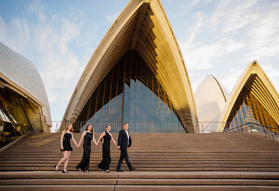 Portrait of a family on the steps of the Opera House during a Sydney Opera House Photoshoot with Sarah Iris Photography.