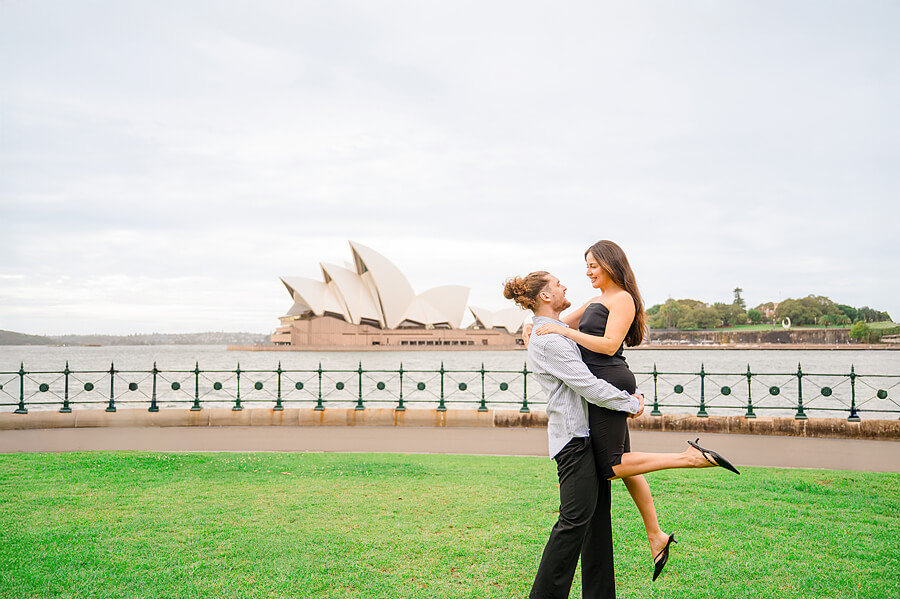 A couple in front of the Sydney Opera House during a photoshoot with a Sydney proposal photographer
