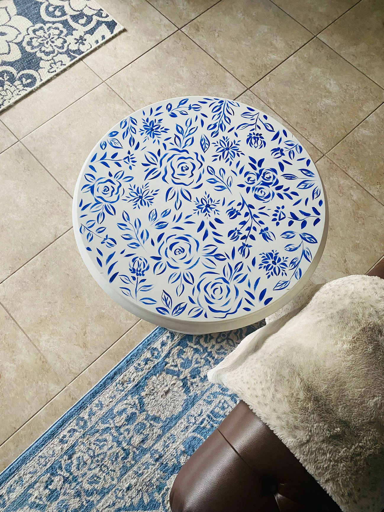 blue and white floral design on a hand painted wood table