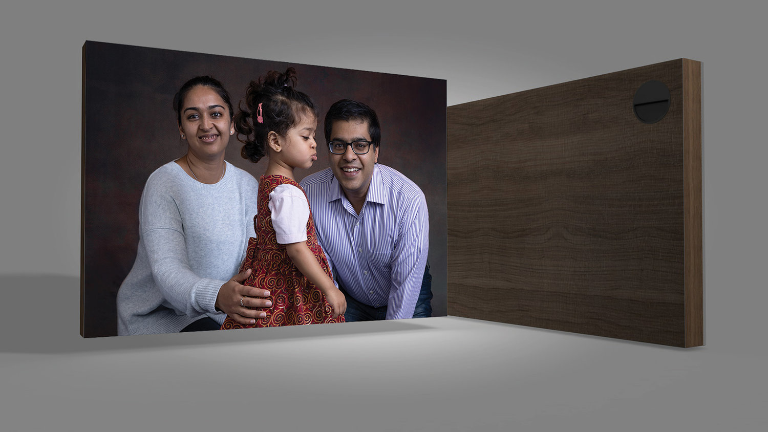 Custom portrait wall art statement piece with a finished family image, reflecting a timeless and handcrafted presentation