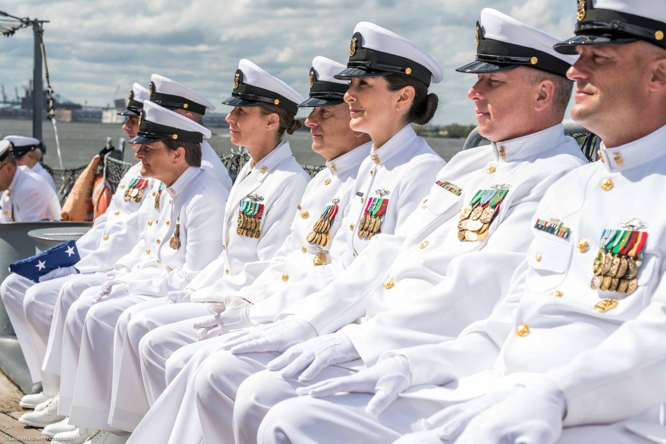 Navy Chiefs sitting together during a military ceremony onboard the USS NEW JERSEY