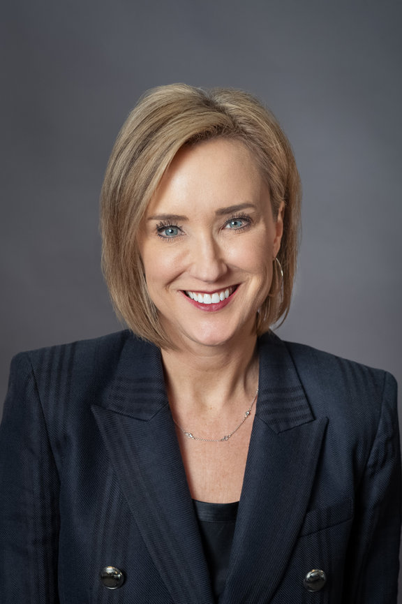 women CEO of Texas corporate headshots on site, professional dallas headshot photographer, red bow tie photography