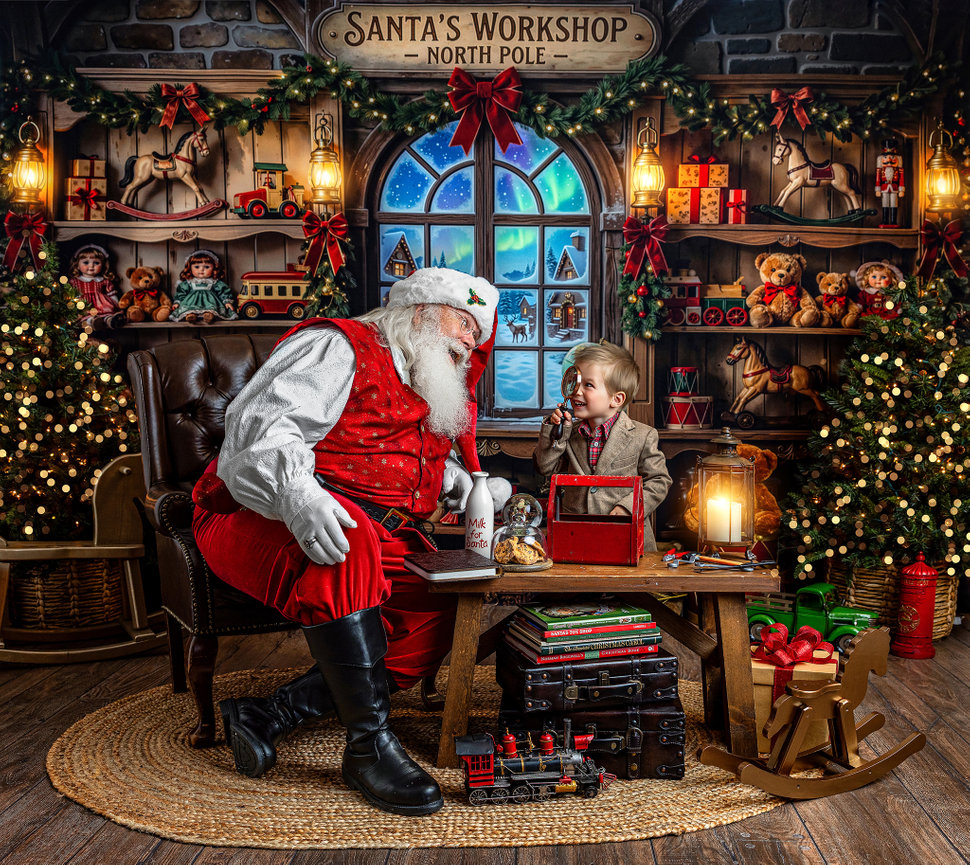 Santa Claus and child enjoying a playful moment together in a festive Santa’s Workshop during a Cleveland area Santa Experience