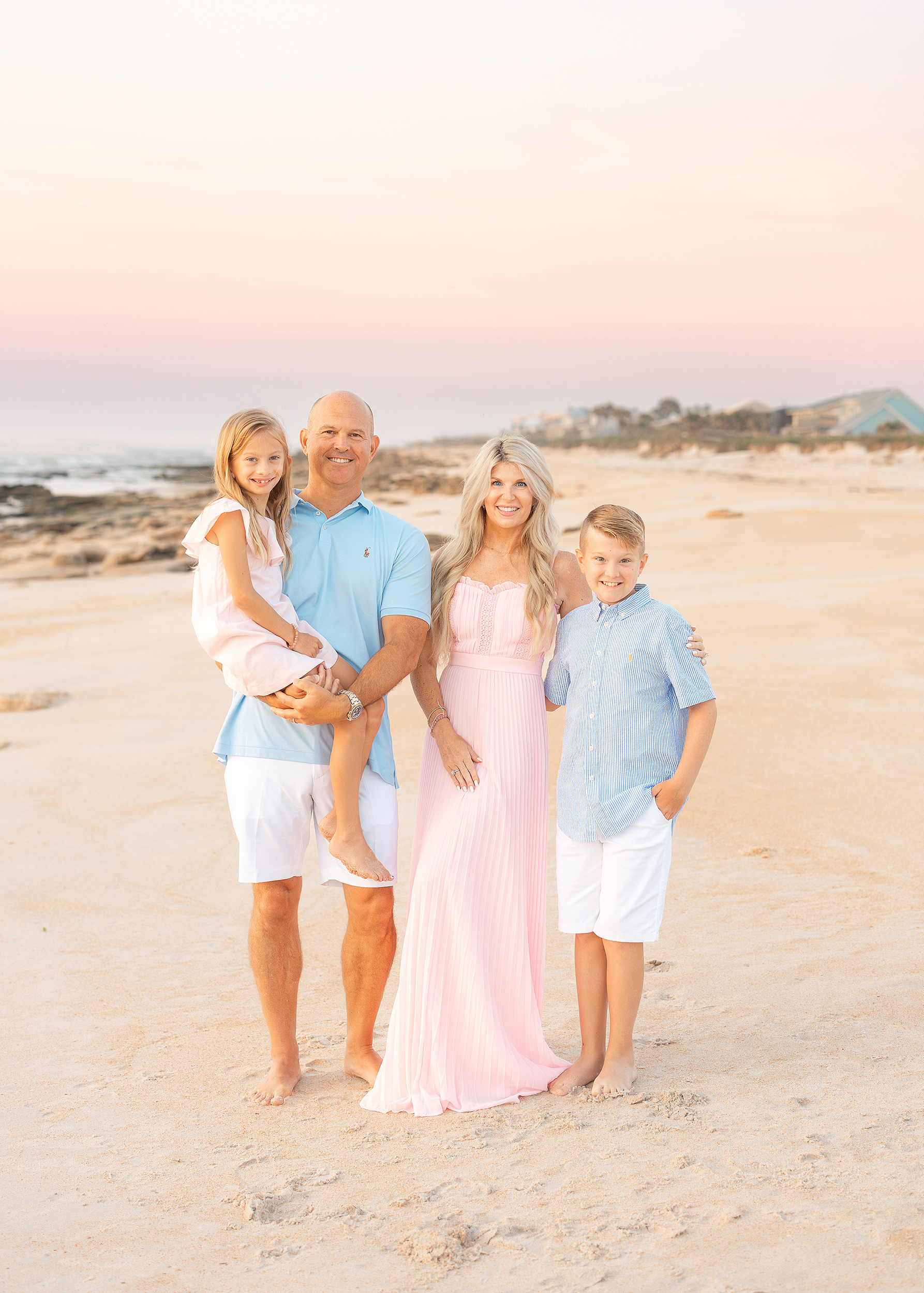 family beach portrait on Saint Augustine Beach with pastel colors at sunrise