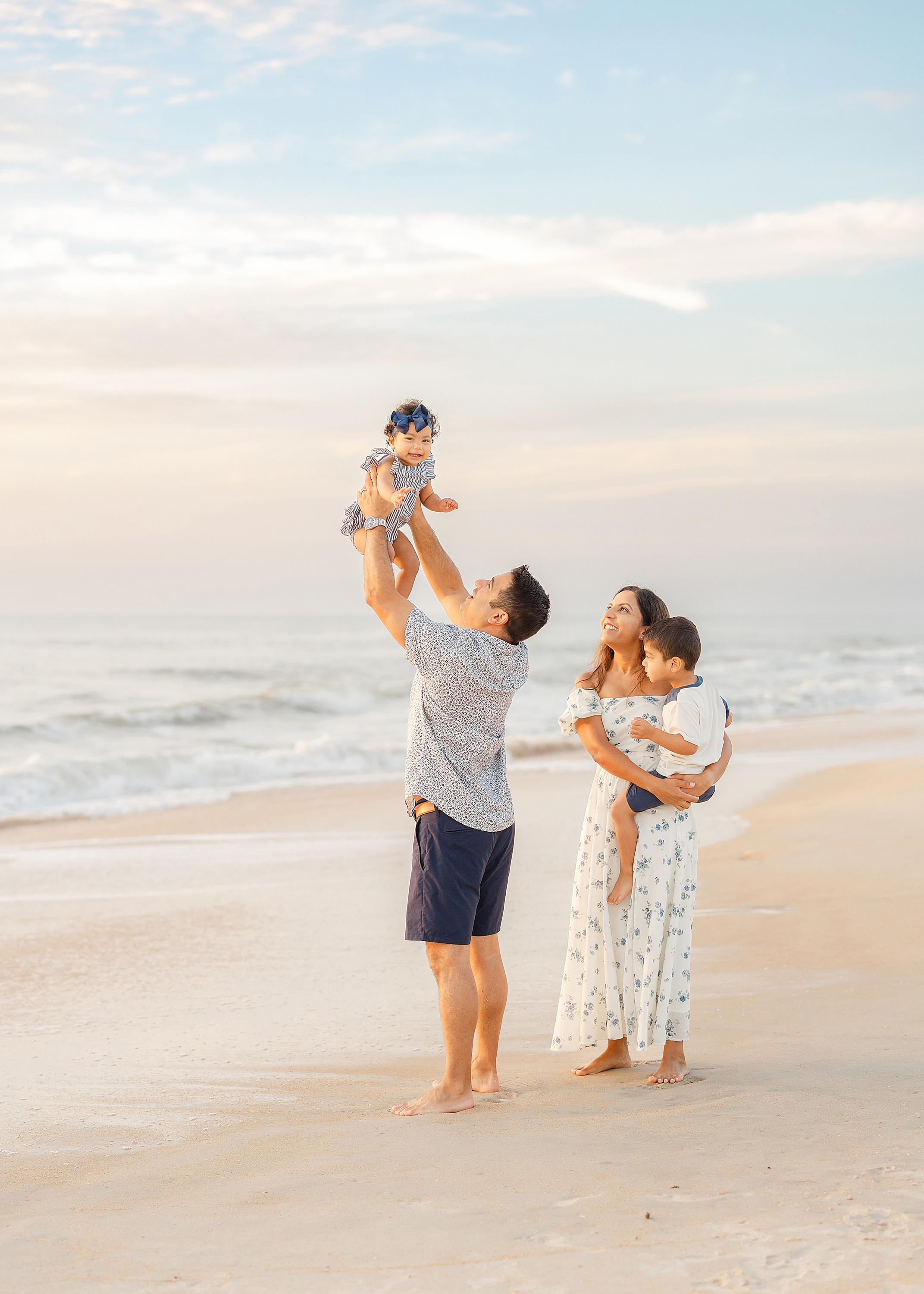 A family on St. Augustine Beach at sunrise