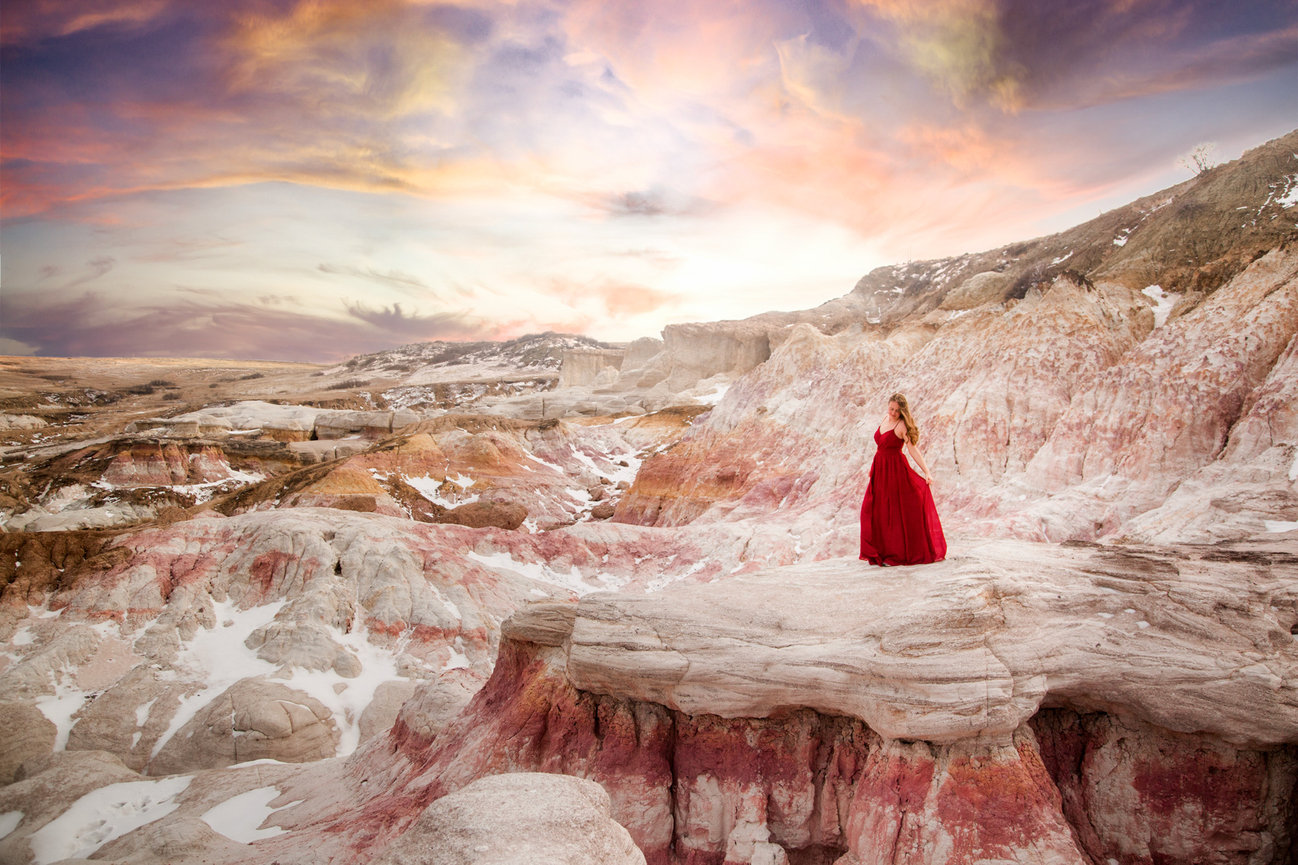 Dramatic portrait of a woman at Painted Mines vast landscape
