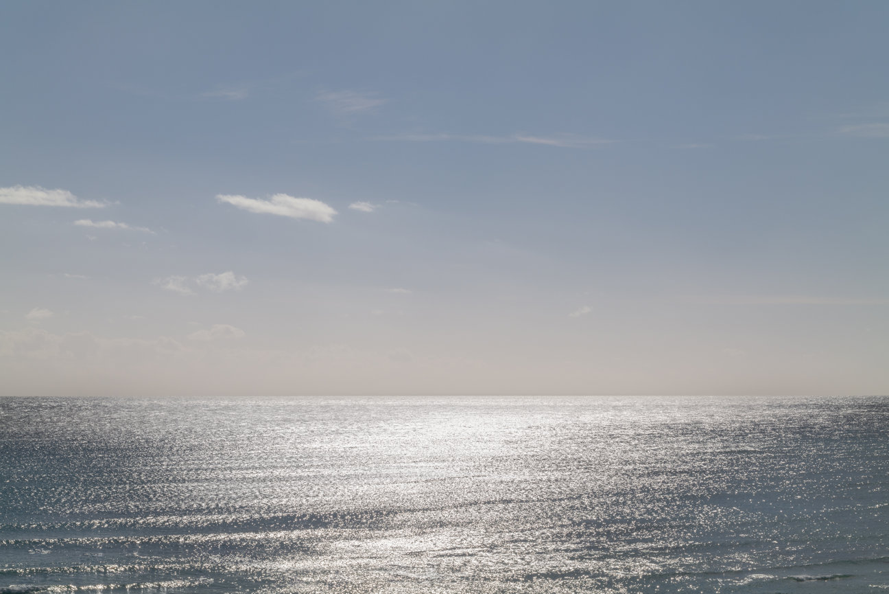 Radiant Horizon - minimalist seascape fine art photography by Andrea Bruns with shimmering Pacific Ocean light and a luminous horizon.