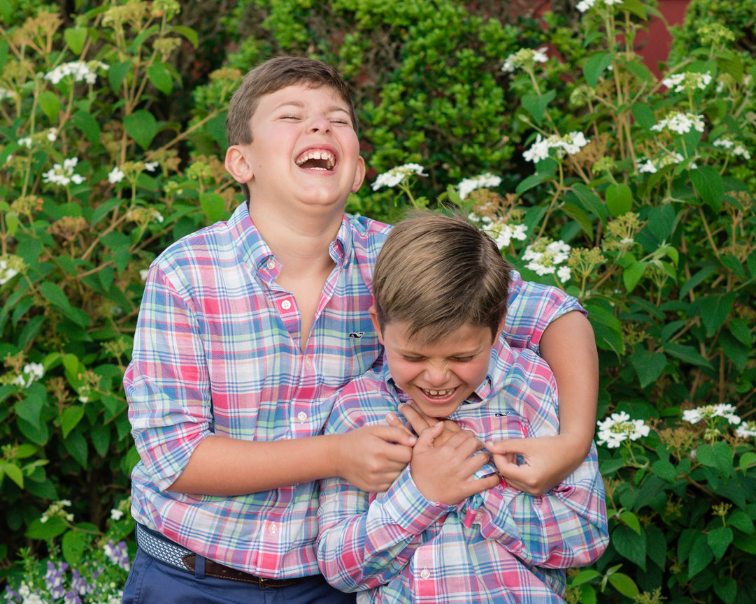 Boys laughing in a garden