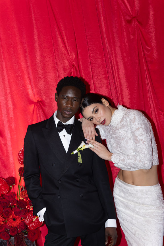 High-fashion bridal portrait at Iscoyd Park: a couple in a tuxedo and lace outfit captured with a cinematic editorial edge.