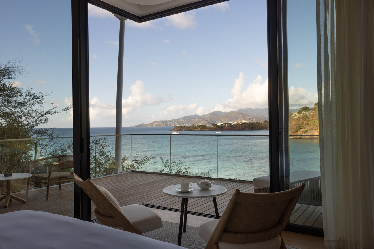 Amazing large Guest room Balcony in Grenada overlooking the view of Ocean and distant Mountains.