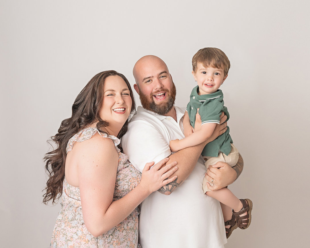 Holmdel family of three enjoying relaxed indoor portrait session