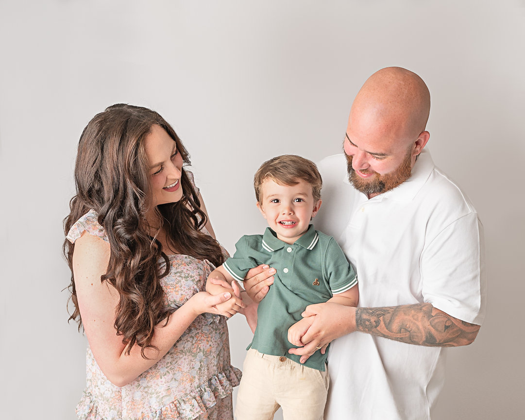 Westfield parents with little boy during modern white backdrop session