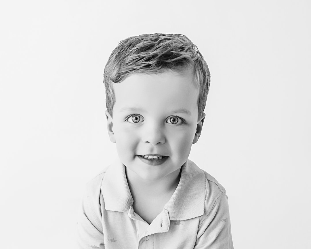 Fine art-inspired portrait of child in clean studio setting