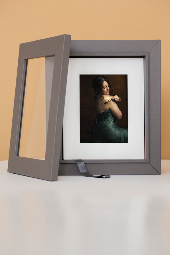 Studio portrait in custom gray frame with stand, designed for Braly Studios IPS product collections.