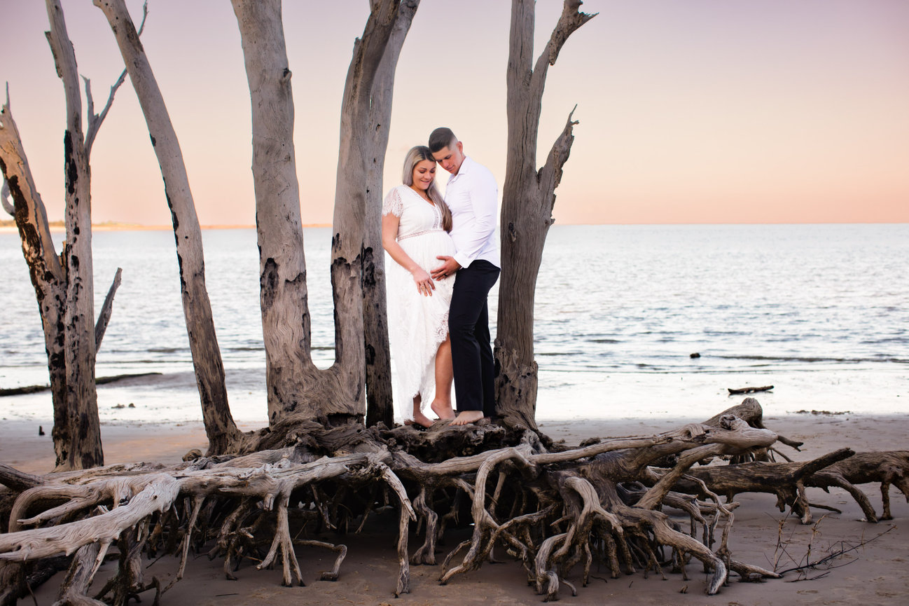 maternity beach session with husband and wife at Boneyard Beach Jacksonville Florida