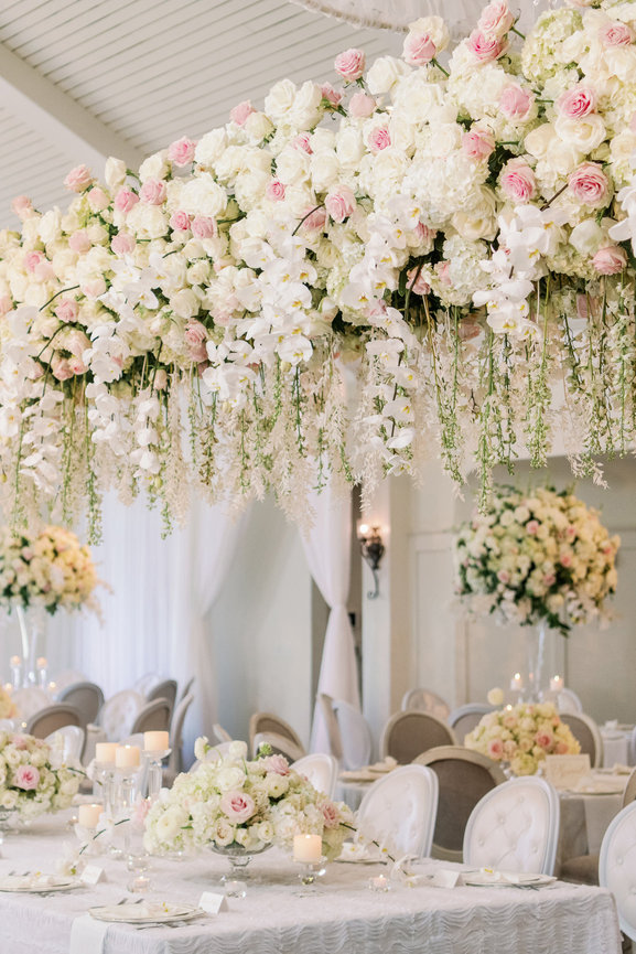 Stunning Pursell Farms wedding seated dinner reception with exquisite floral design in shades of white. Wedding photography by Heather Durham.