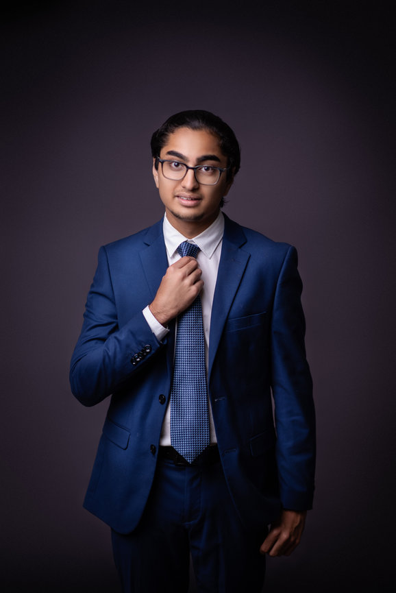 Portrait of a young man in a blue suit