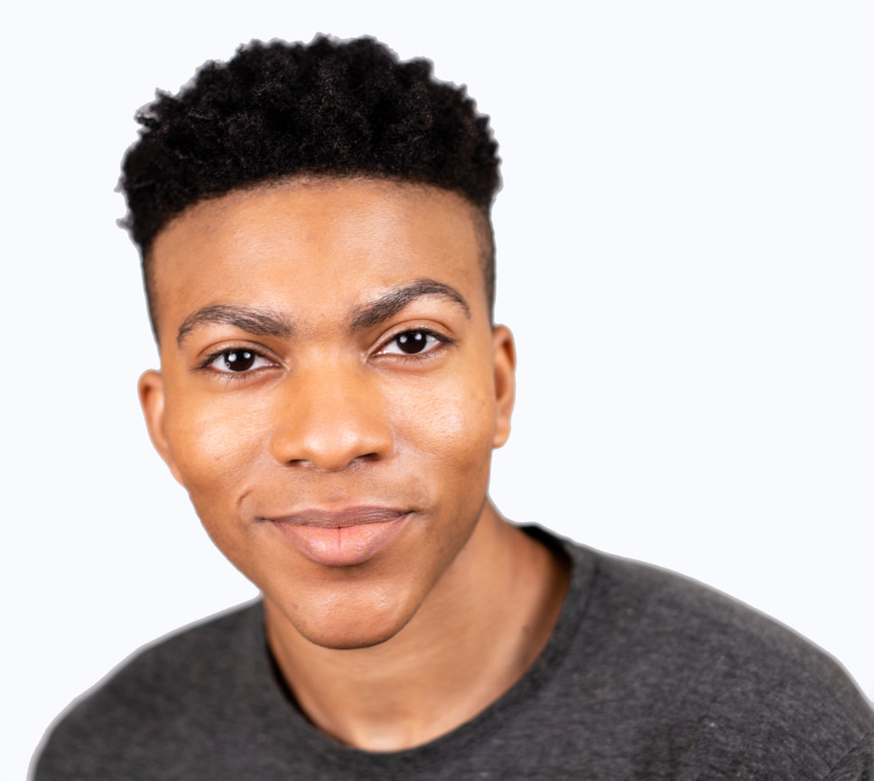 Man in gray sweater smiling