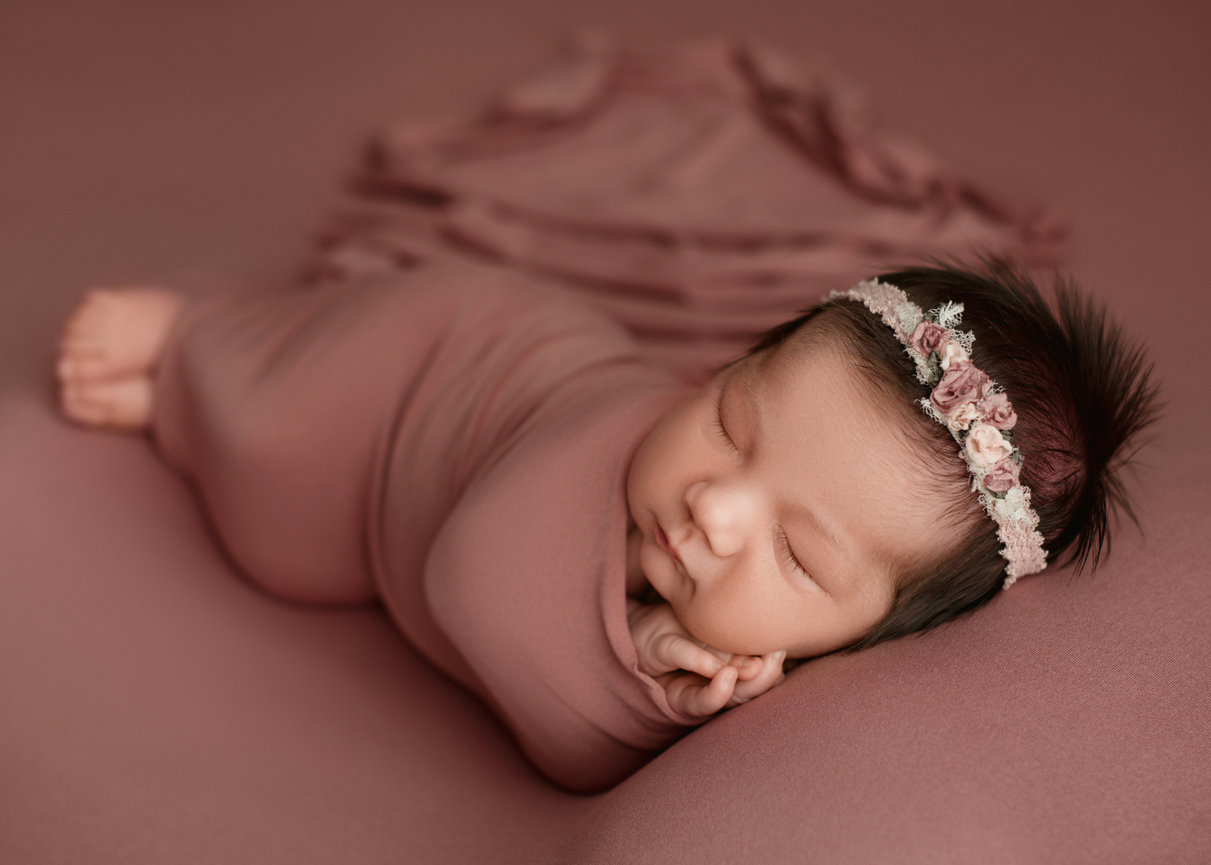 Professional newborn photography in Panama City Beach FL home studio setting