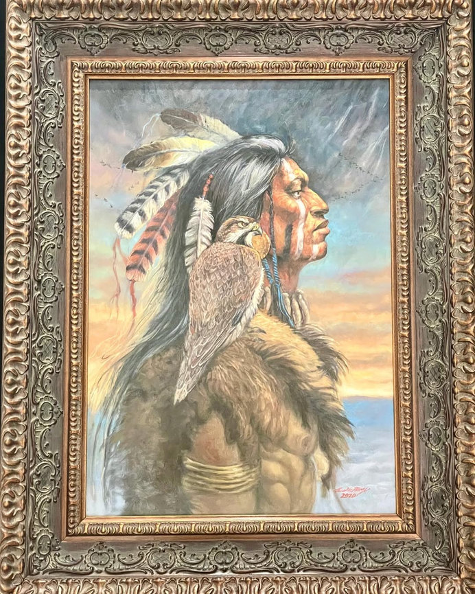Framed painting of a Native American figure wearing traditional headdress and clothing