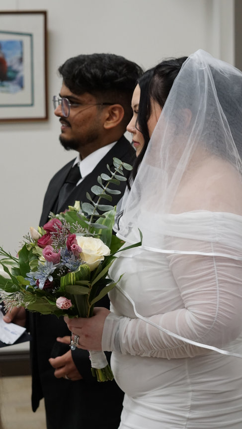 Bride and groom standing together at a wedding ceremony
